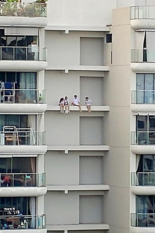 Teenagers put their lives on the edge of 16th-storey ledge