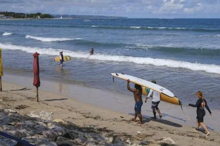 Russian tourist deported from Bali over half-naked photo on sacred peak