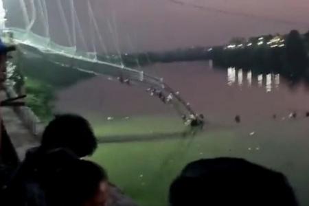 More than 120 killed in India as packed suspension bridge collapses