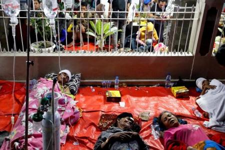 More than 160 dead, hundreds injured after 5.6 earthquake hits Indonesia