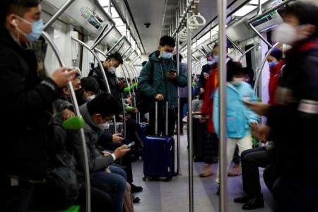 Beijing subway drops mandatory Covid-19 mask rule