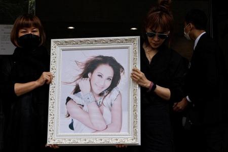 Late singer Coco Lee’s estranged husband says at crematorium he loved her 