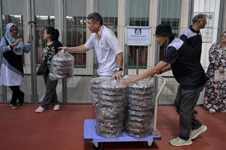 Low-income families get cookies, groceries and spruce-up for homes ahead of Hari Raya