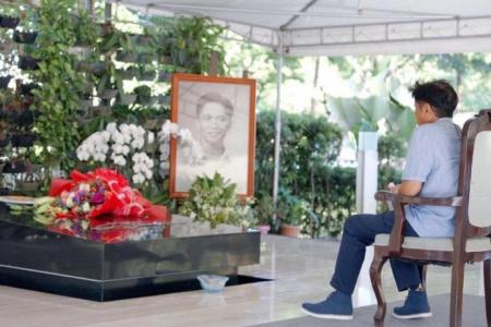 Philippine election winner Marcos visits dictator father's grave