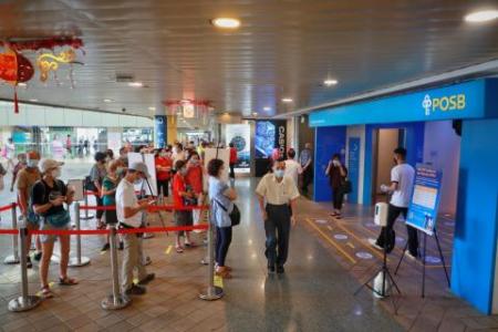 Long queues at banks, pop-up ATMs for new Chinese New Year notes