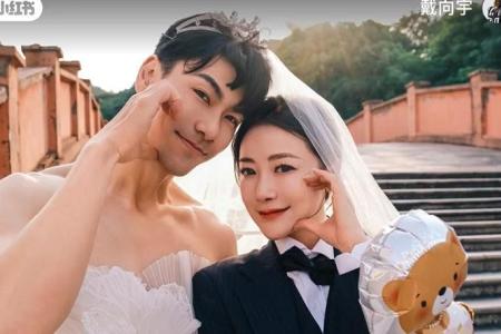 Dai Xiangyu swops wedding finery with wife on 8th anniversary of nuptials