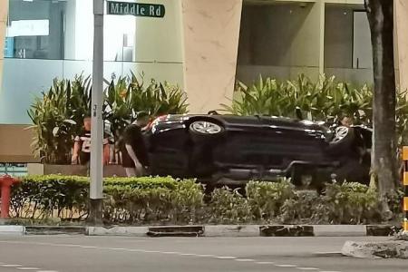 Car flips on side after crashing into tree near Middle Road