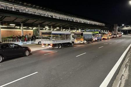 Migrant workers rely on illegal truck service in Kranji due to lack of transport options