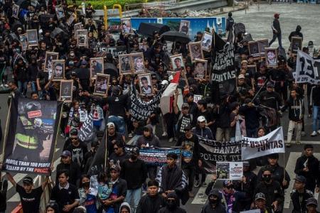 Indonesians march for justice after deadly soccer stampede