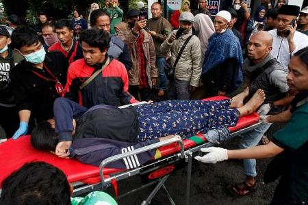 More than 160 dead, hundreds injured after 5.6 earthquake hits Indonesia