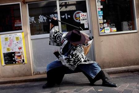 Samurai trash collectors clean Tokyo streets after Halloween revels