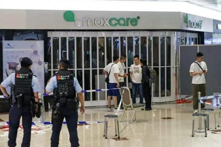 Man fatally stabs 2 women in Hong Kong mall, plunging his knife 25 times into one of them