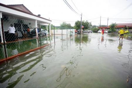 PM Ismail calls in troops to help as floods hit Malaysia, with more rain expected