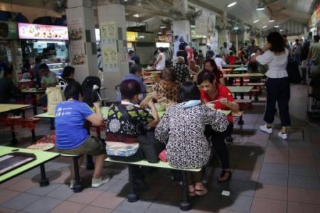 Buzz returns as hawker centres, coffee shops open to groups of 5 from different households