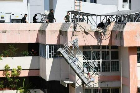 2 workers saved from tipping gondola at Boon Lay HDB block