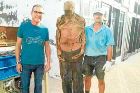 Spanish gravedigger suspended for posing with exhumed corpse in photo