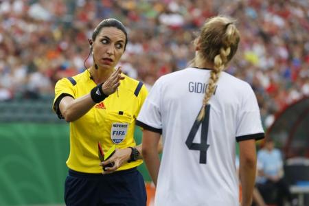 Ouch! Female referee gets smacked in face by a football