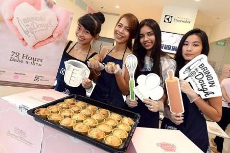 New Face finalists get busy in charity bake-a-thon