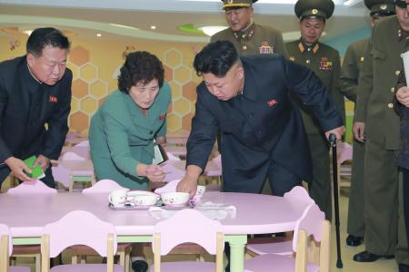Kim Jong Un has a tea party at an orphanage... with no children in it