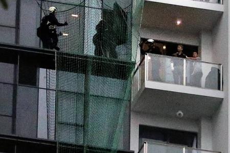 High drama as woman sits on 14th storey ledge for 3 hours 