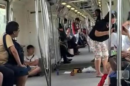Boy spits at commuter on MRT train