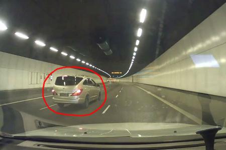 Watch: KPE terror cabbie drives recklessly, hurls vulgarities and throws items at car