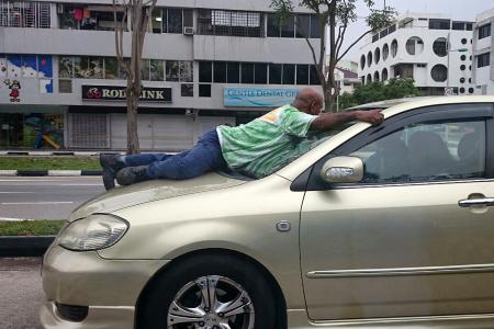 Man fined for driving with man on car bonnet