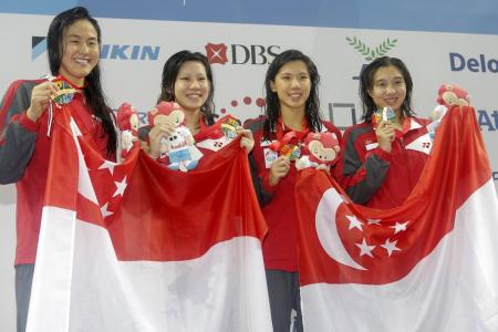 S'pore swimmers clinch two golds on first day