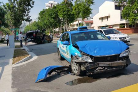 Collision causes SUV to overturn