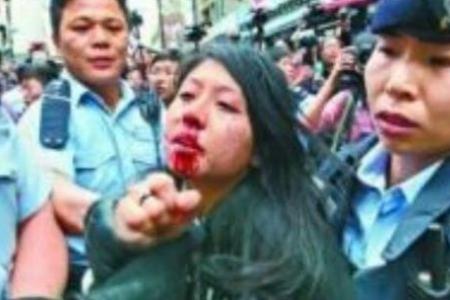 Hong Kong woman convicted of hitting police officer with her breast