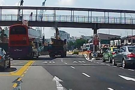 Excavator on lorry hits pedestrian bridge at Upper Thomson Road