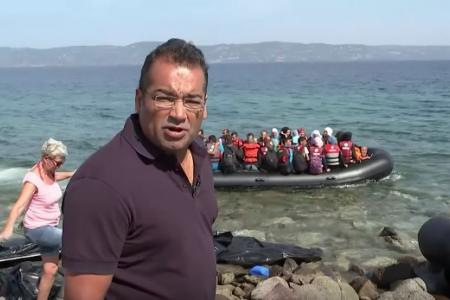 News presenter stops report to help refugees