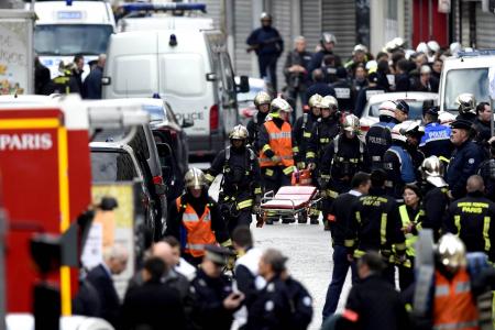 Paris assault: Woman blows herself up, man killed