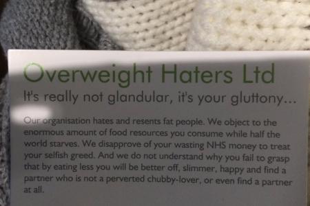 'Overweight Haters' hand fat-shaming cards to commuters on London tube