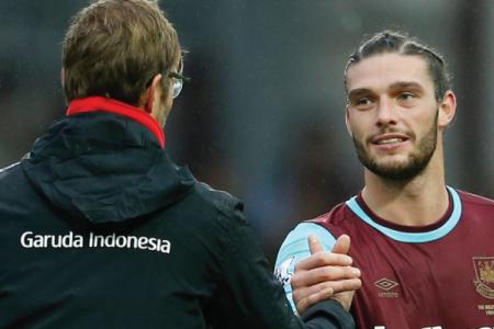Carroll strikes back to sink Liverpool