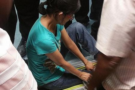 Woman's leg slips into MRT platform gap
