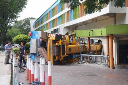 Crane crashes into Woodlands building