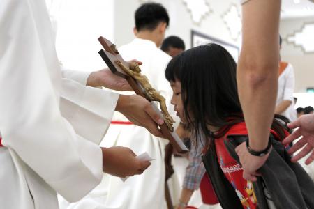 Churchgoers observe Good Friday with outdoor procession