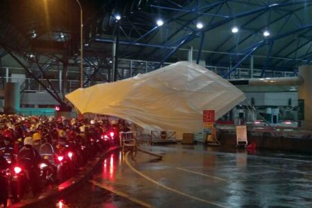 Two hurt after canopies collapse in heavy rain at Tuas Checkpoint