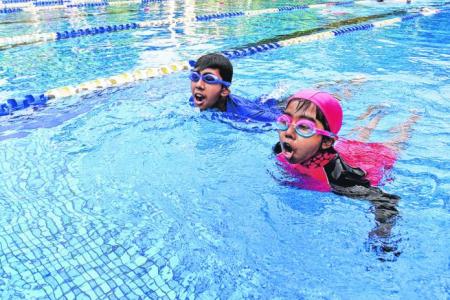 Siblings swim to raise funds for kids with kidney failure