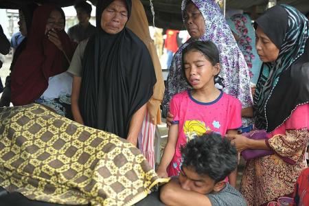 Indonesia quake kills at least 97