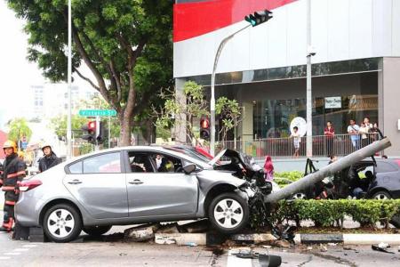 Eight hurt as car topples traffic light in Bugis