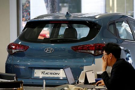 Hyundai cuts costs, looks to designing new models