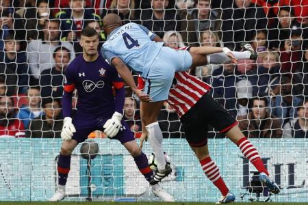 Manchester City&#039;s Vincent Kompany scores their first goal