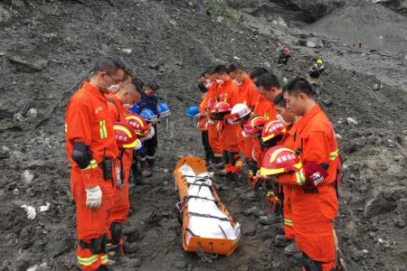 Rescuers told to evacuate due to risk of second landslide