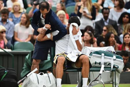 Novak overcomes injury scare to reach q-finals