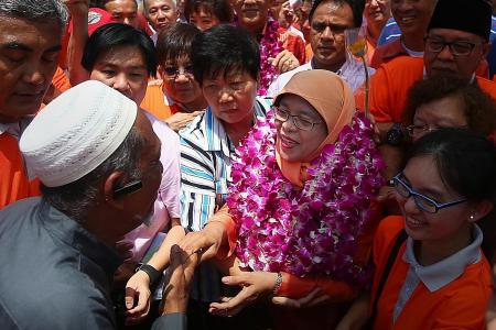 Cheers as Halimah arrives at PA headquarters