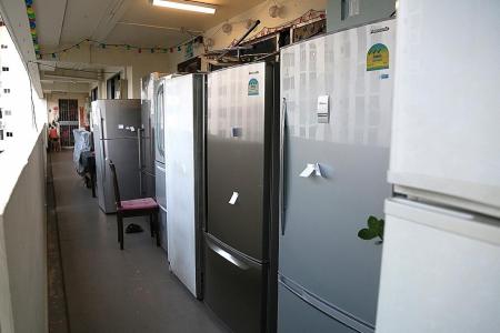 7 fridges lined up along HDB corridor in Simei riles resident