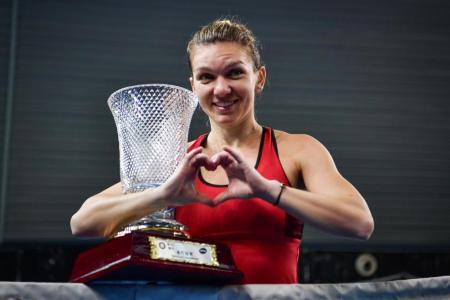 Halep hopes no-brand dress can bring her luck