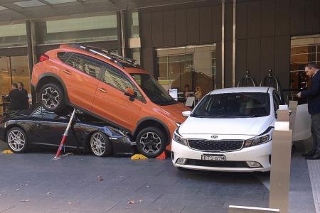 Sydney valet drives Porsche under SUV as parking attempt goes awry